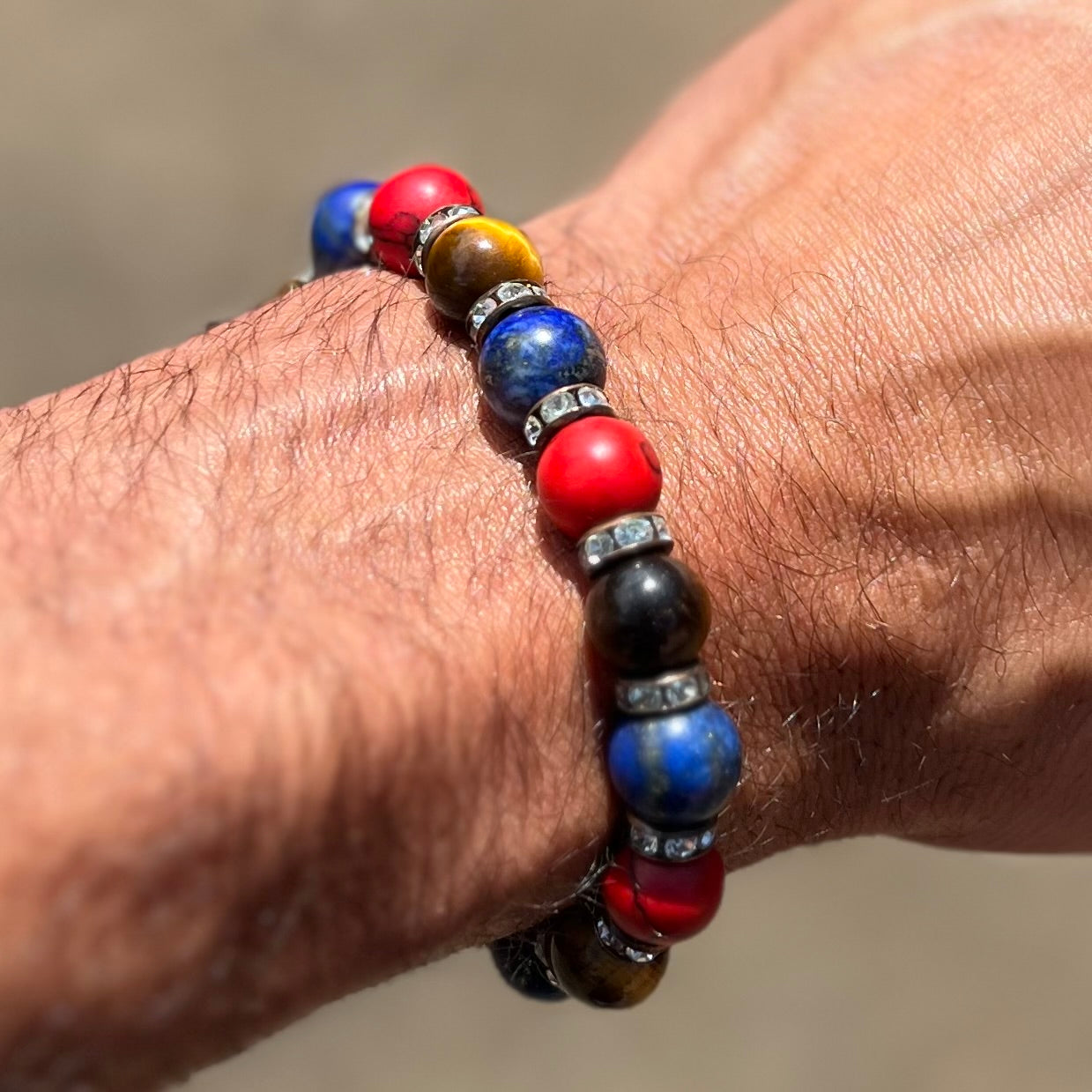 Red, Blue, and Brown bracelet with gold spacers