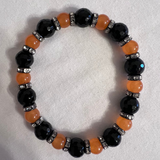 Black & orange bracelet with spacers