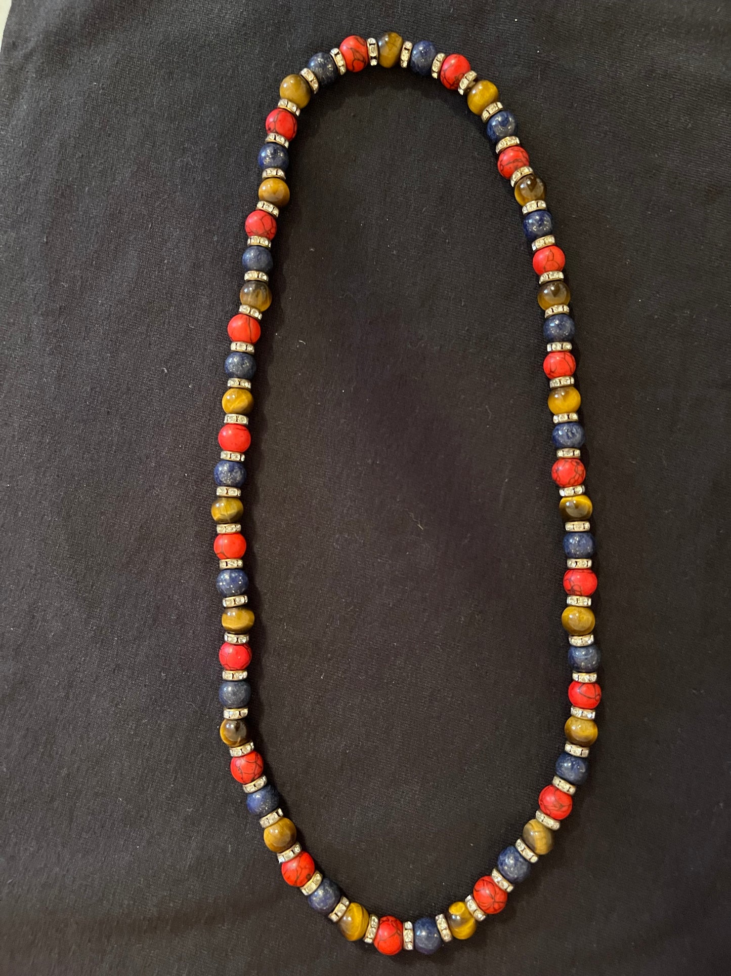 Red, Brown, and Blue necklace with gold spacers